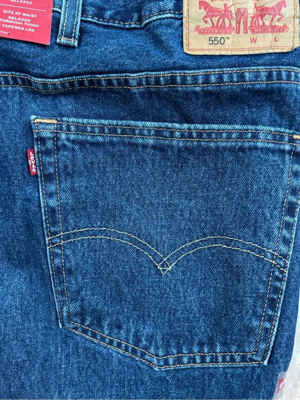 NWT Levi's 550’s with a 63W x 30L relaxed fit.